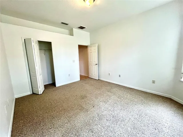 a view of empty room with windows