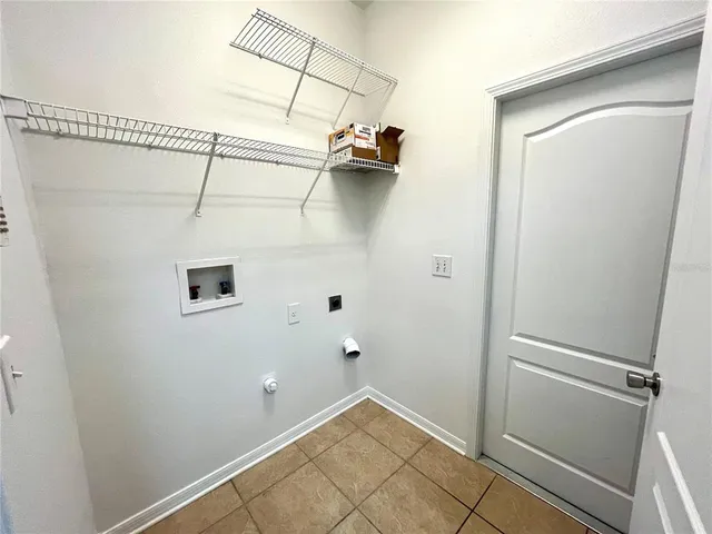 a view of a lake with houses in the back