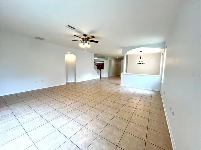 a kitchen with stainless steel appliances granite countertop a stove top oven a sink dishwasher and a microwave oven on the blue kitchen countertops