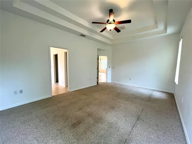 a spacious bathroom with a double vanity sink a mirror and a bathtub
