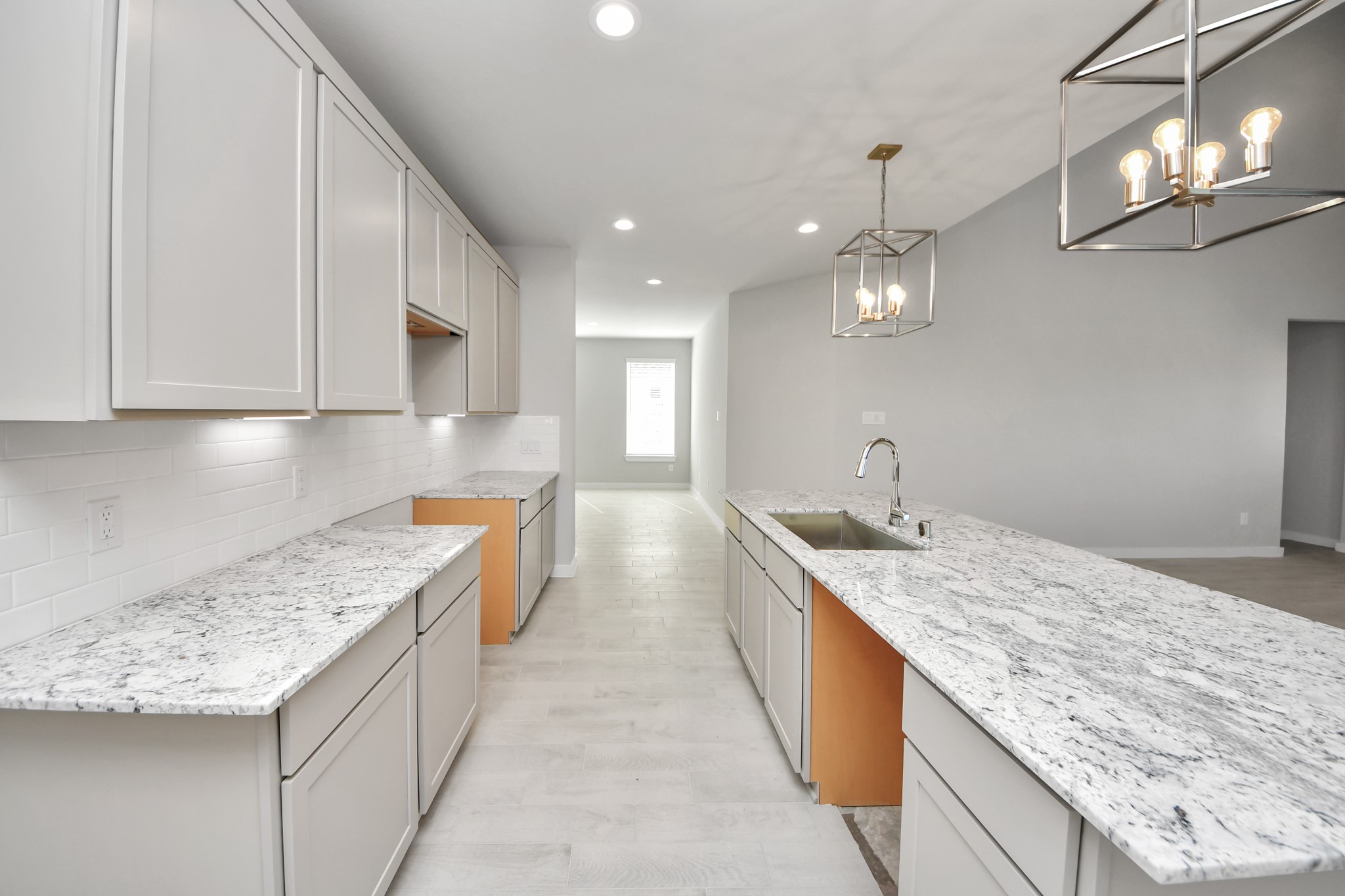 2922 Burris Park Drive Spring, TX 77373 - Photo 15 of 37 Discover another perspective of this stunning kitchen, generously appointed with an abundance of counter space. Sample photo of completed home with similar floor plan. Actual colors and selections may vary.