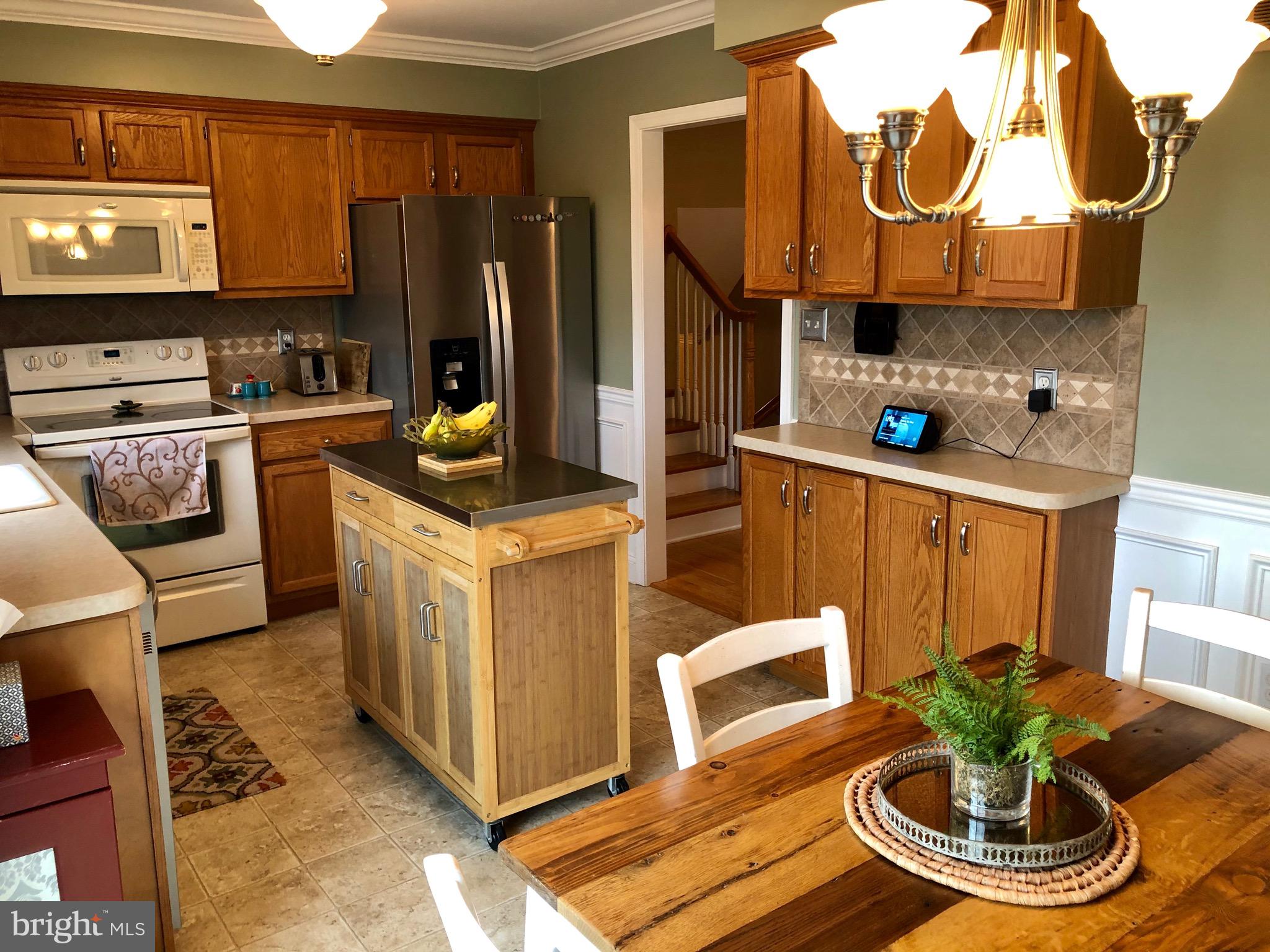 708 Millers Spring Road York, PA 17406 - Photo 9 of 45 Kitchen with breakfast area, glass sliders to deck