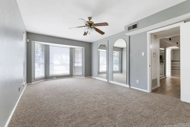a bathroom with a granite countertop sink a mirror and a vanity