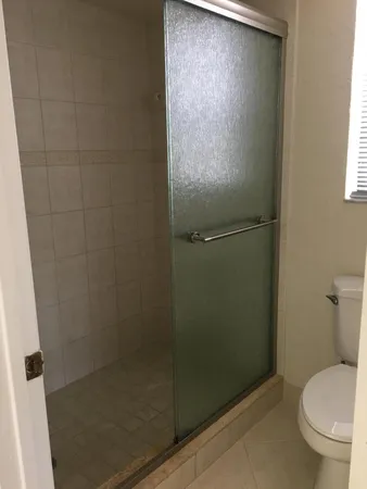 an empty room that has a window in it