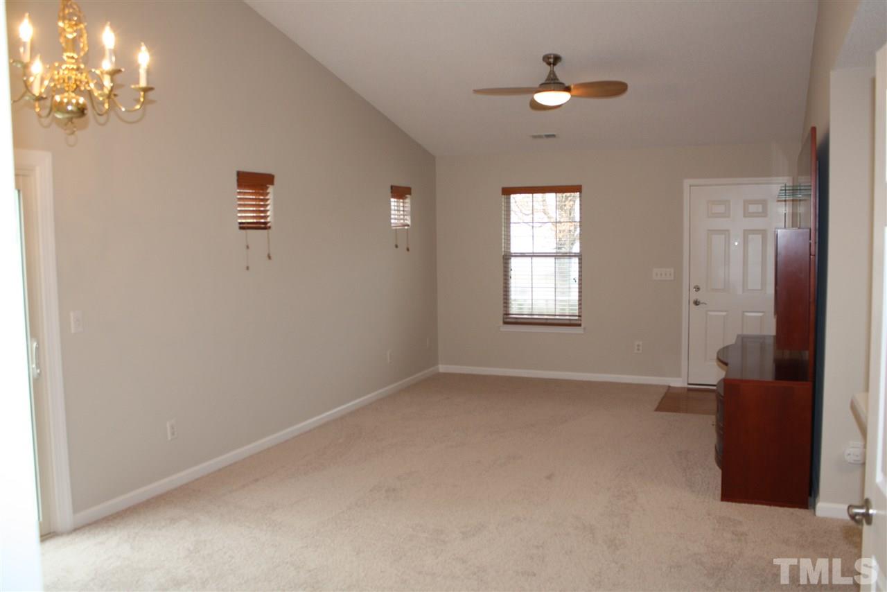 8912 Shallcross Way Raleigh, NC 27617 - Photo 2 of 20 an empty room with windows and closet