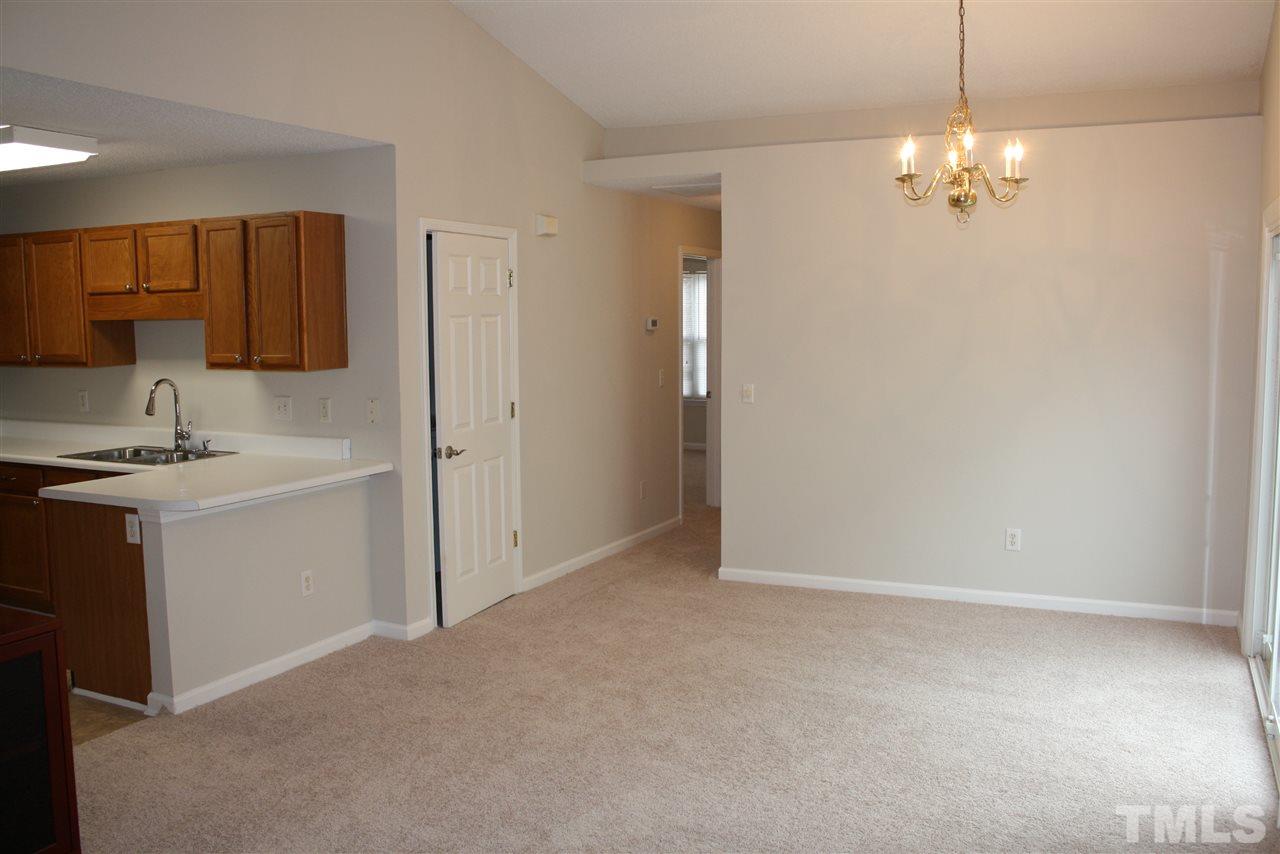 8912 Shallcross Way Raleigh, NC 27617 - Photo 12 of 20 a view of a kitchen with a sink a cabinet and dishwasher