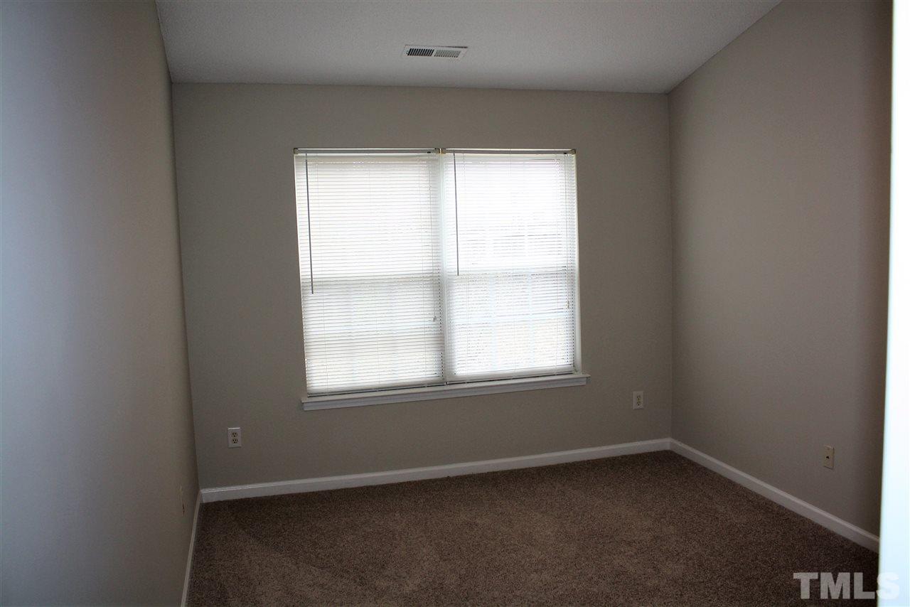 8912 Shallcross Way Raleigh, NC 27617 - Photo 15 of 20 an empty room with a window