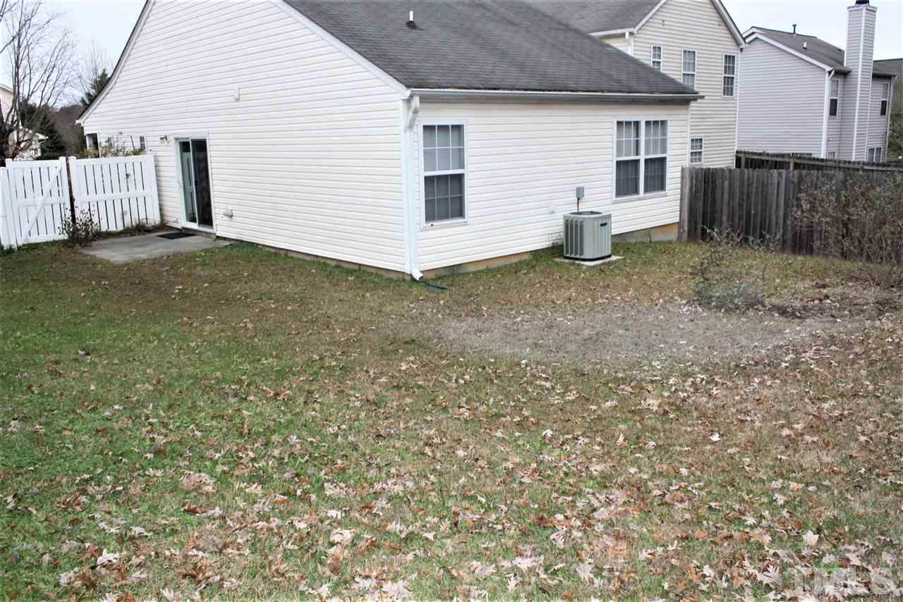 8912 Shallcross Way Raleigh, NC 27617 - Photo 19 of 20 a view of a house with a yard and fence