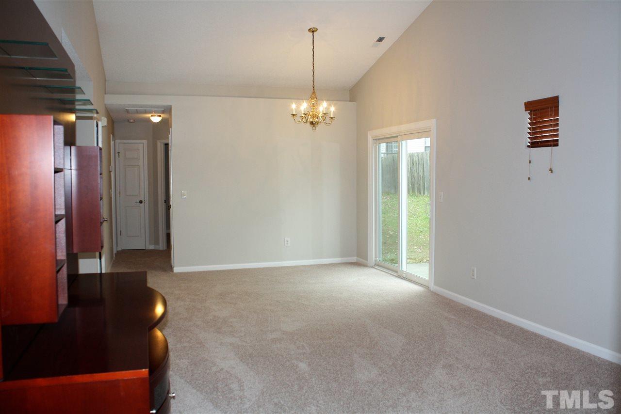 8912 Shallcross Way Raleigh, NC 27617 - Photo 6 of 20 a view of a livingroom with a kitchen space