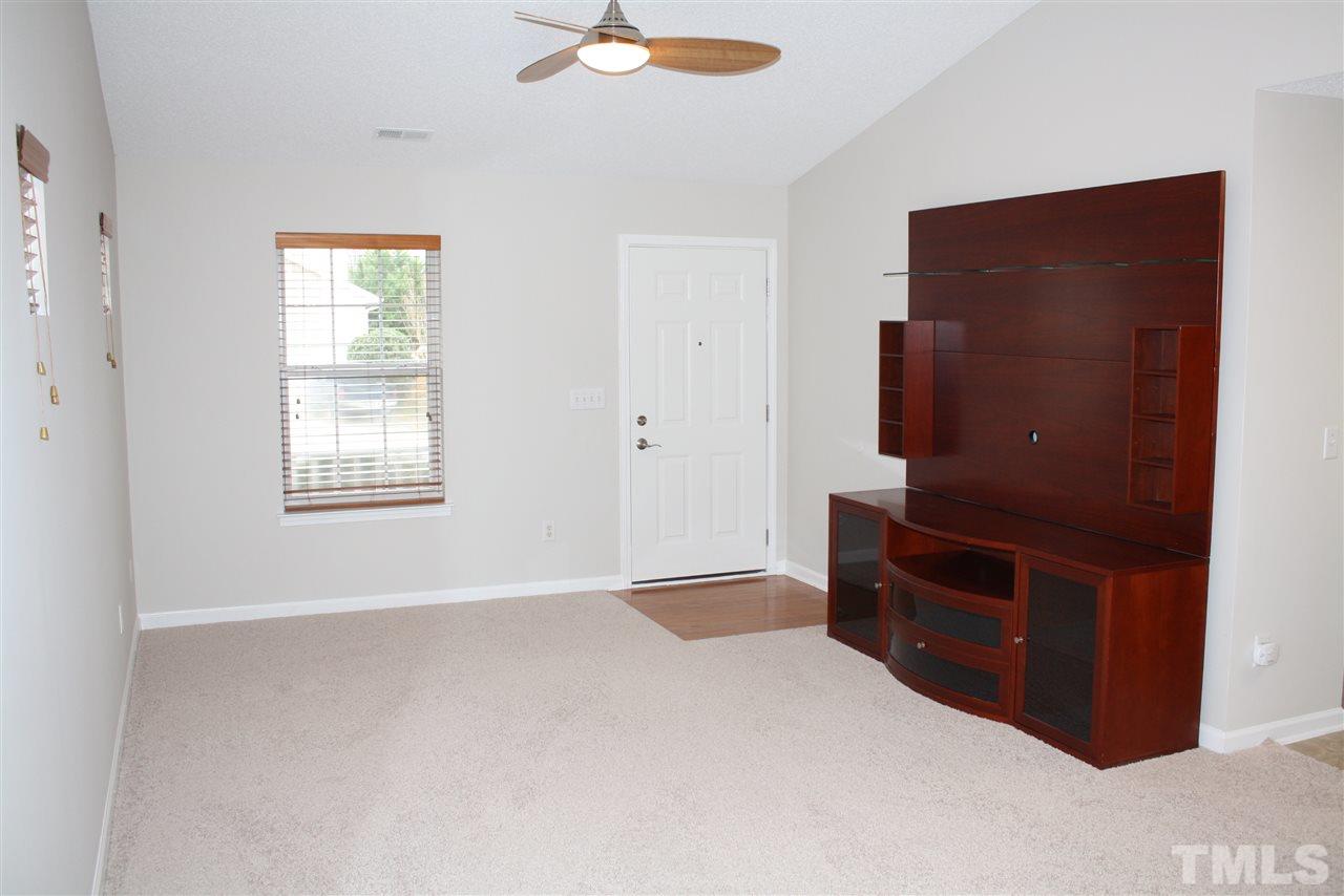 8912 Shallcross Way Raleigh, NC 27617 - Photo 8 of 20 a view of an empty room with a dresser