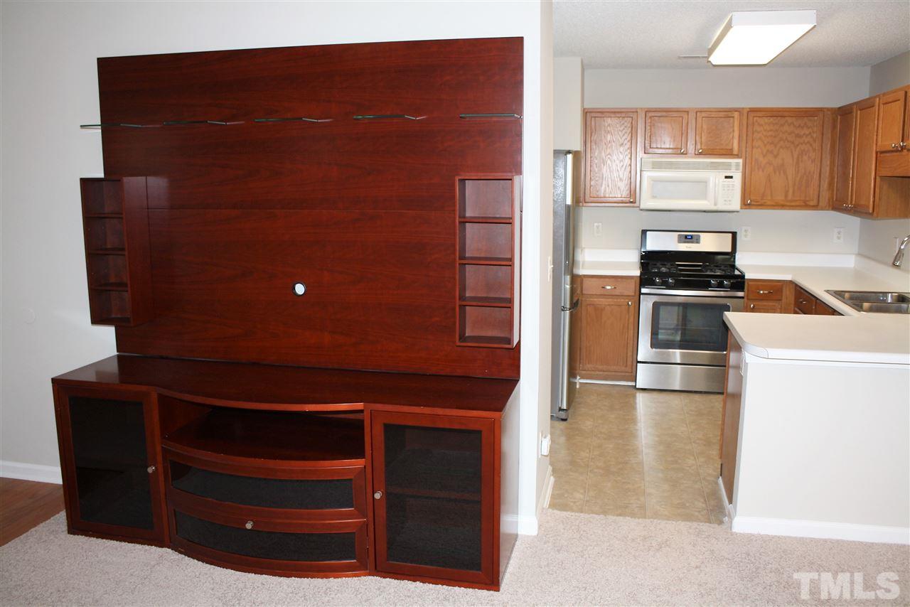 8912 Shallcross Way Raleigh, NC 27617 - Photo 9 of 20 a kitchen with cabinets and appliances