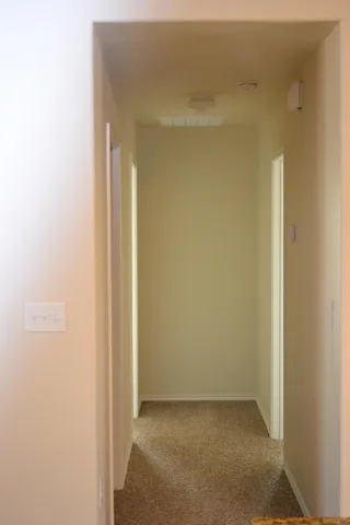 a view of hallway with closet