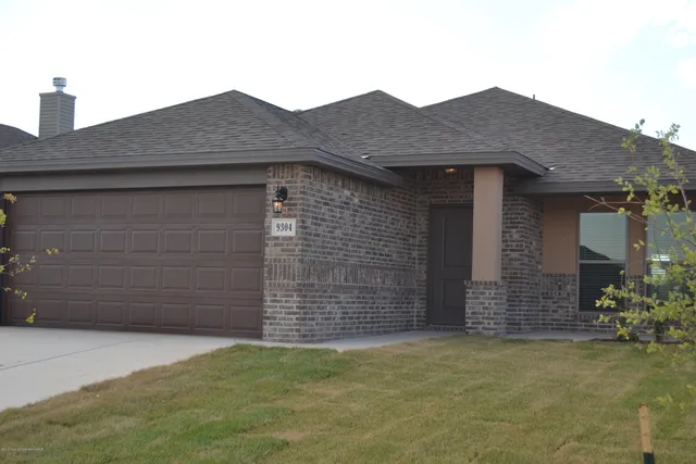 a front view of a house with a garage