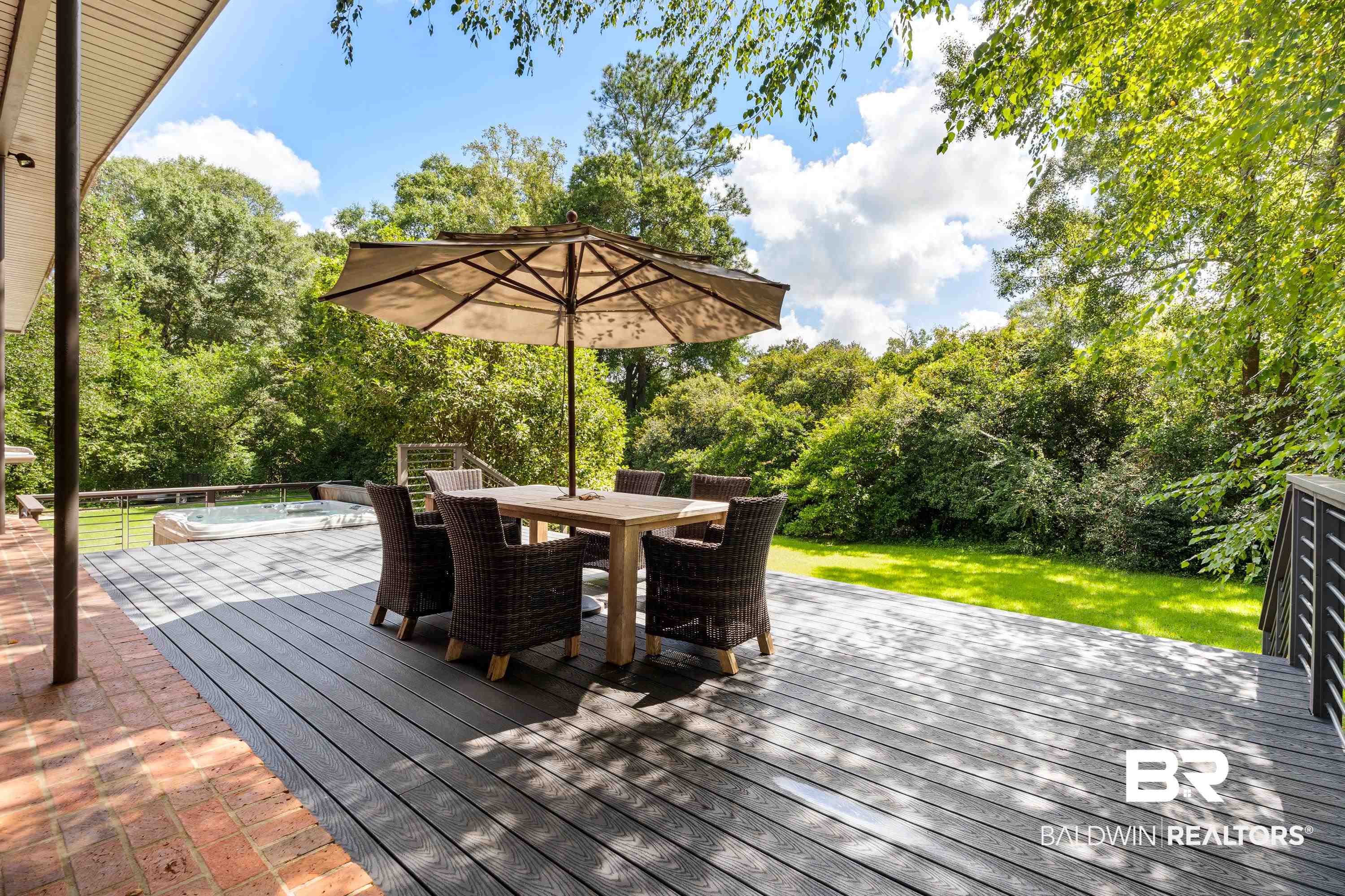 233 Suzanne Circle Mobile, AL 36608 - Photo 57 of 85 Wooden deck featuring outdoor dining area, a lawn, and a hot tub