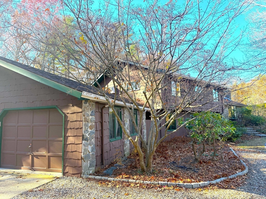 a view of a house with a tree