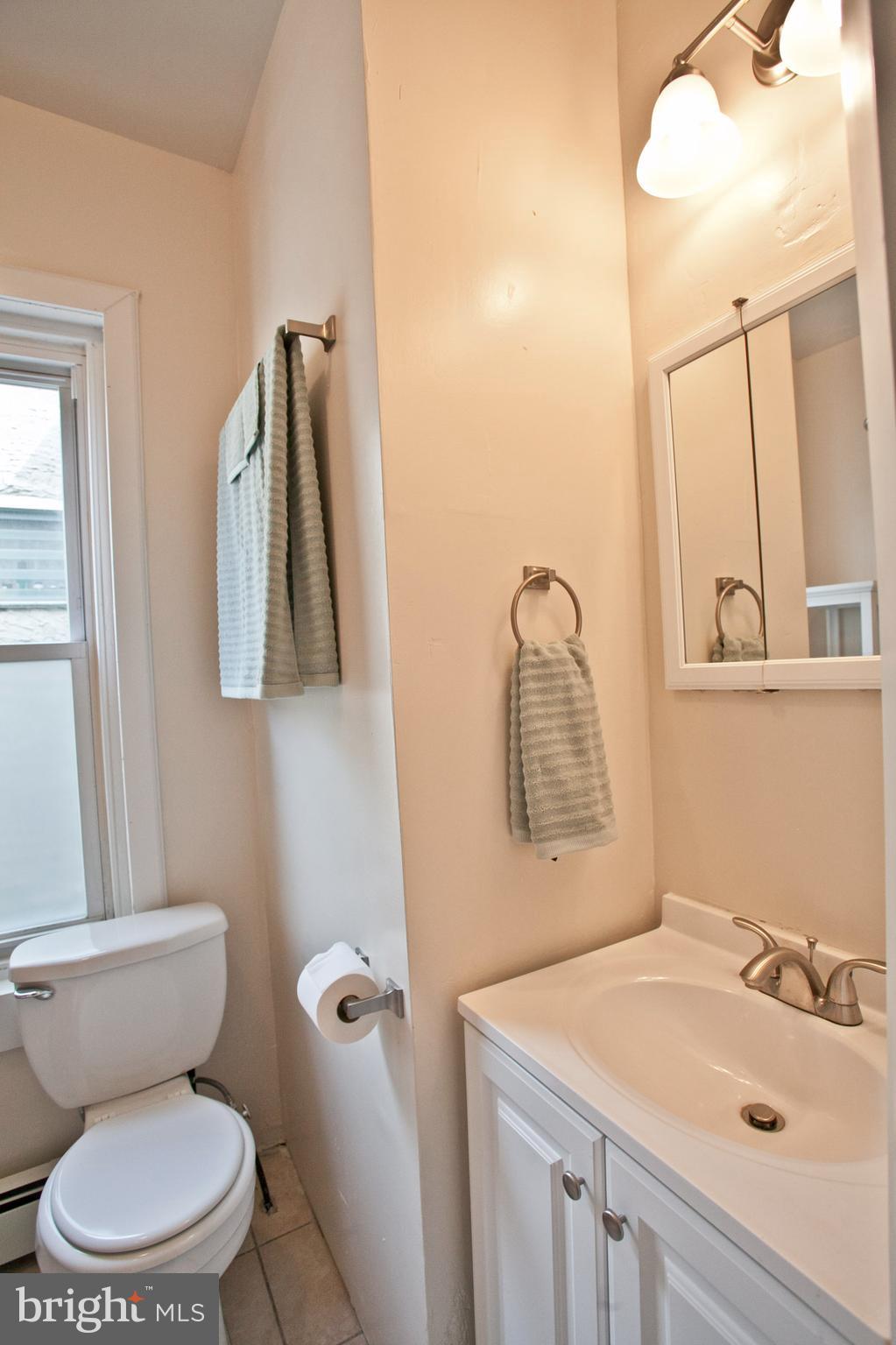 4205 Terrace Street Philadelphia, PA 19128 - Photo 14 of 30 a bathroom with a sink toilet and mirror