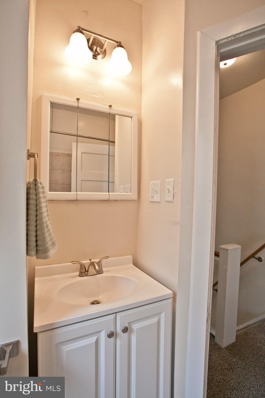 4205 Terrace Street Philadelphia, PA 19128 - Photo 15 of 30 a bathroom with a sink a vanity and a mirror