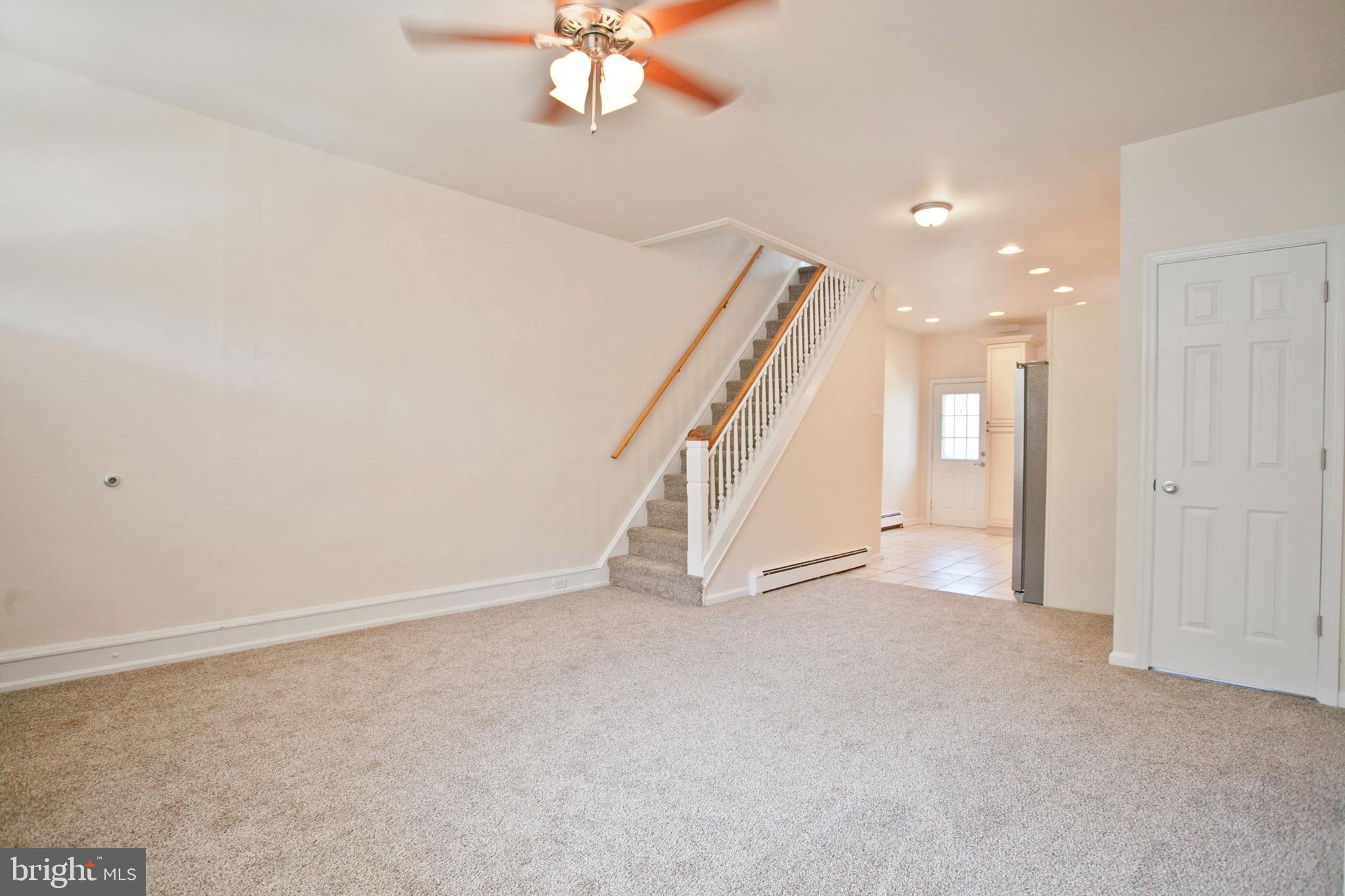 4205 Terrace Street Philadelphia, PA 19128 - Photo 2 of 30 wooden floor in an empty room with a chandelier