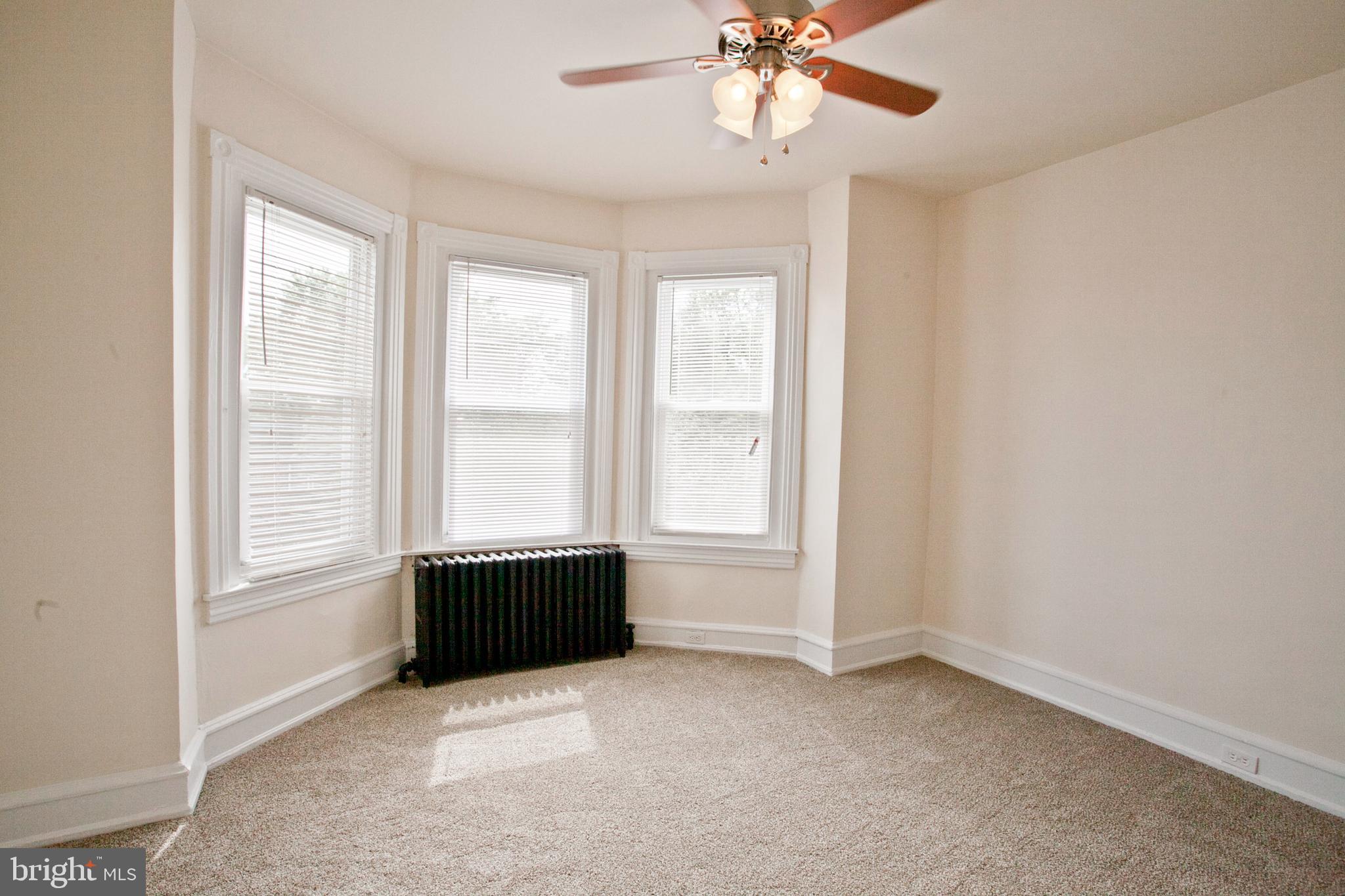 4205 Terrace Street Philadelphia, PA 19128 - Photo 23 of 30 an empty room with windows and ceiling fan