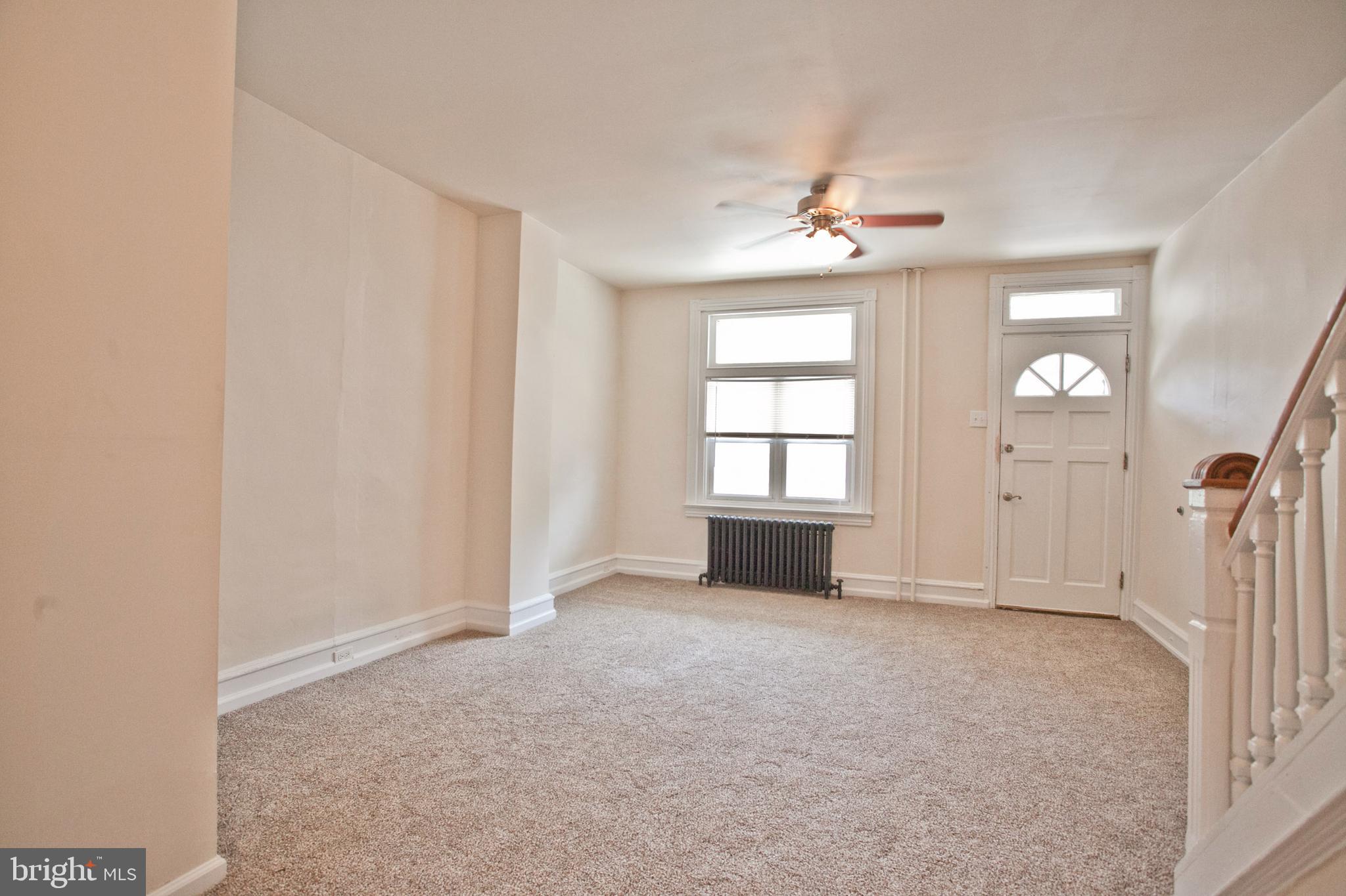 4205 Terrace Street Philadelphia, PA 19128 - Photo 4 of 30 an empty room with windows and ceiling fan