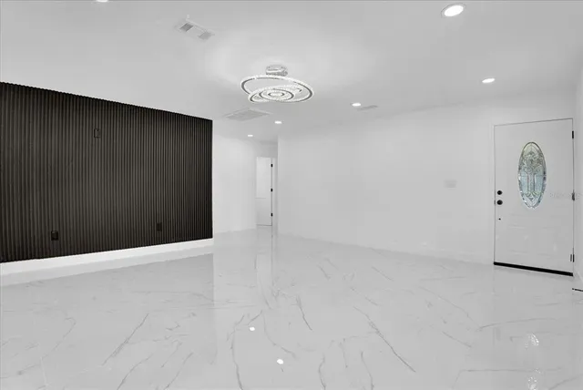 an empty room with fan