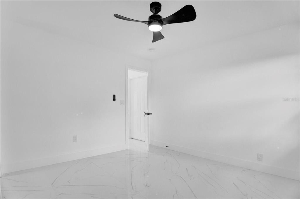 201 Massachusetts Avenue St. Cloud, FL 34769 - Photo 17 of 33 a view of a room with a fan