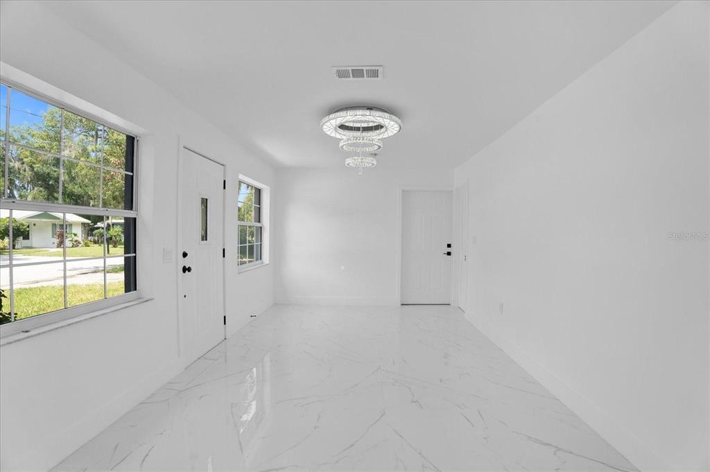 201 Massachusetts Avenue St. Cloud, FL 34769 - Photo 18 of 33 a view of an empty room with a window