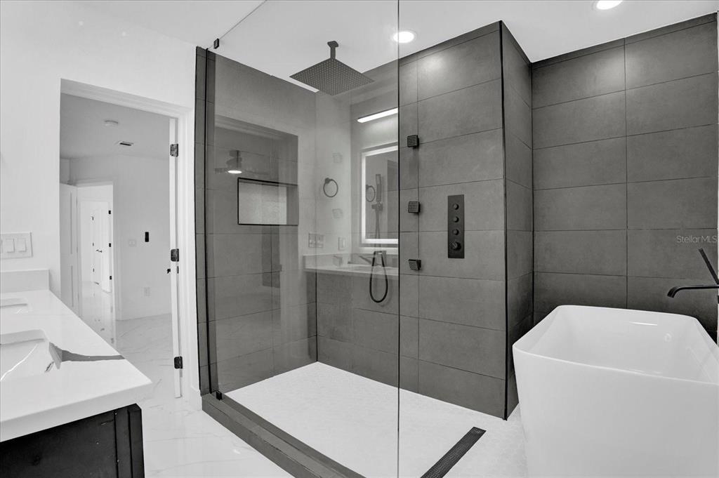 201 Massachusetts Avenue St. Cloud, FL 34769 - Photo 23 of 33 a bathroom with a sink a toilet and shower