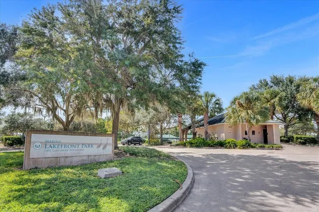 a view of a lake with boats and trees