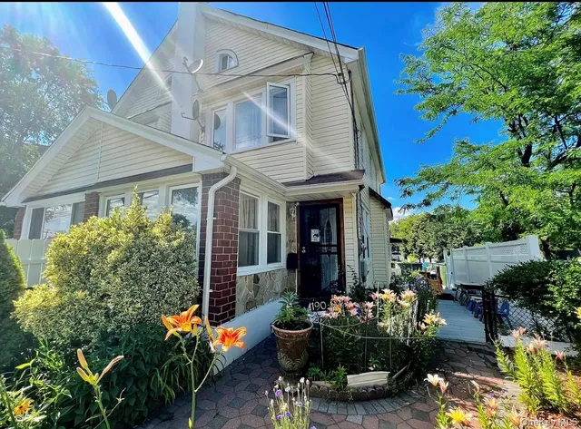 a view of a patio with table and chairs potted plants