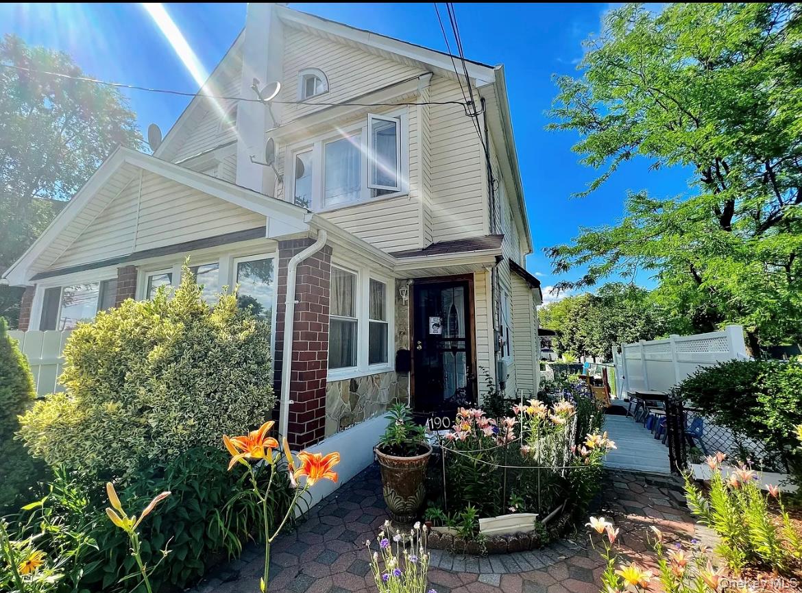 a view of a patio with table and chairs potted plants
