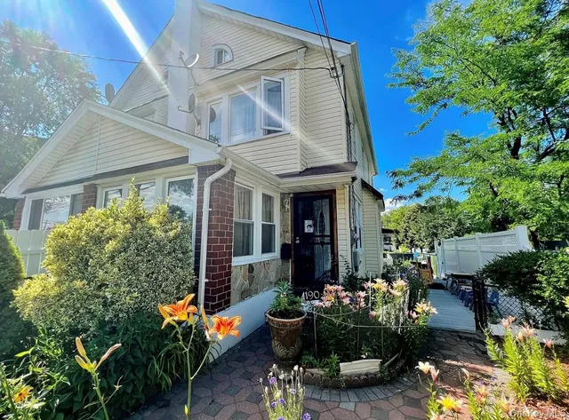 a living room with furniture a chandelier and a fireplace