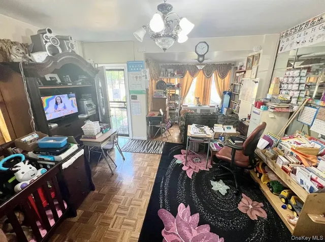 a living room with furniture and a mirror