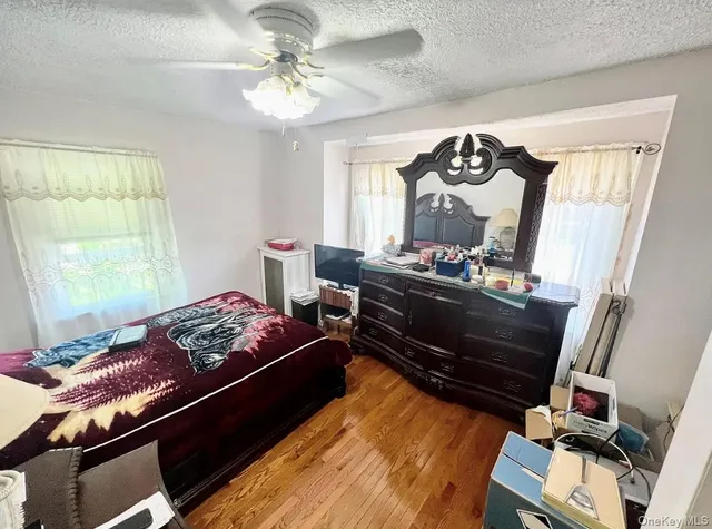 a bedroom with two beds and a window