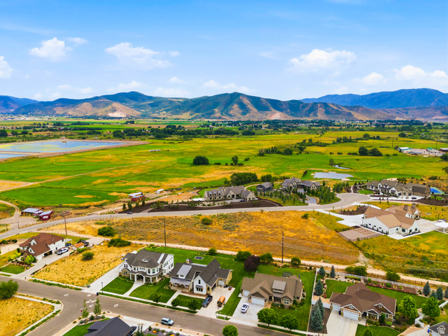 574 South Fox Den Road, Unit 3 Midway, UT 84049 - Photo 15 of 45 Expansive rural landscape with distant mountains and a mixture of agricultural fields and residential developments