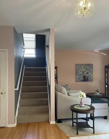 a view of a livingroom with furniture window and wooden floor