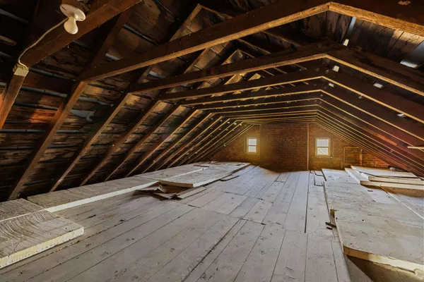 a view of empty room with wooden walls