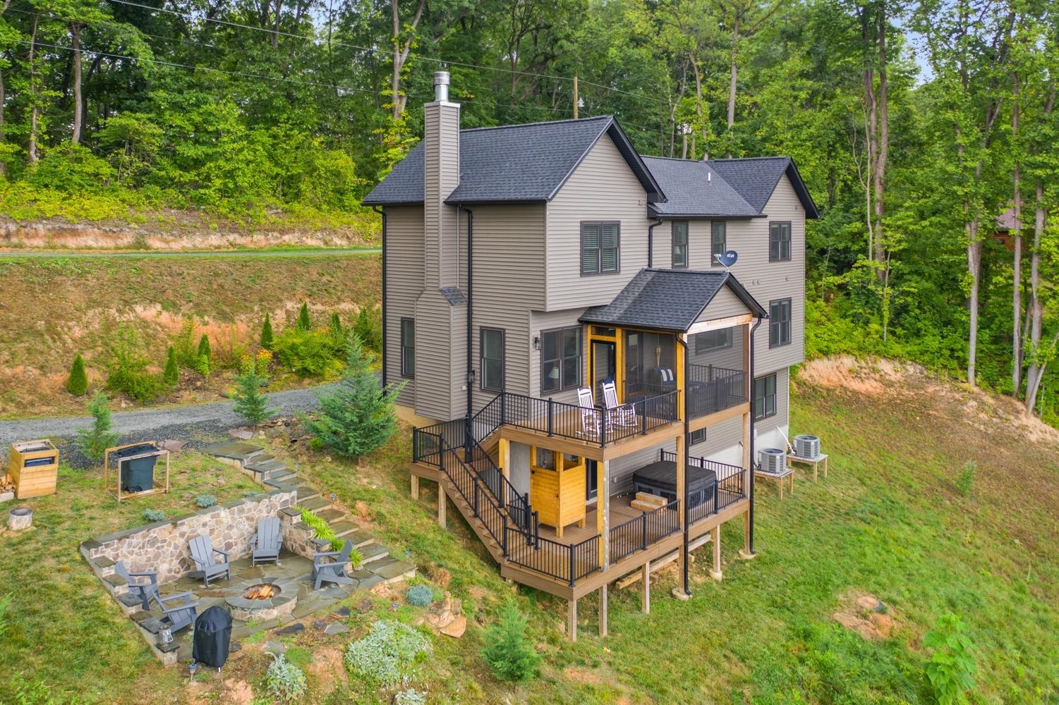 761 Top Ridge Road Stanardsville, VA 22973 - Photo 2 of 49 an aerial view of a house with swimming pool garden view and lake view