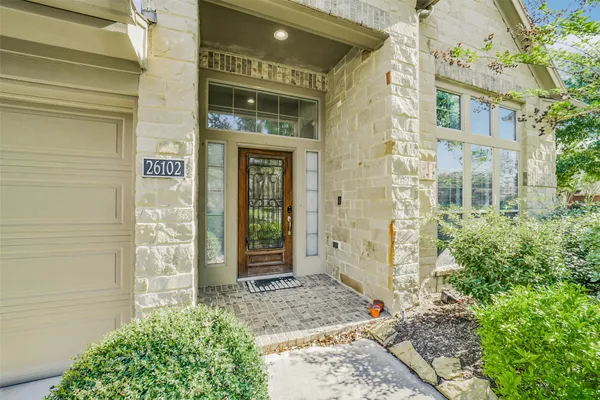 a view of a brick house with front door