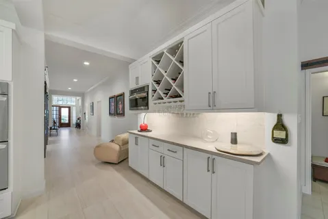 a kitchen with cabinets and window