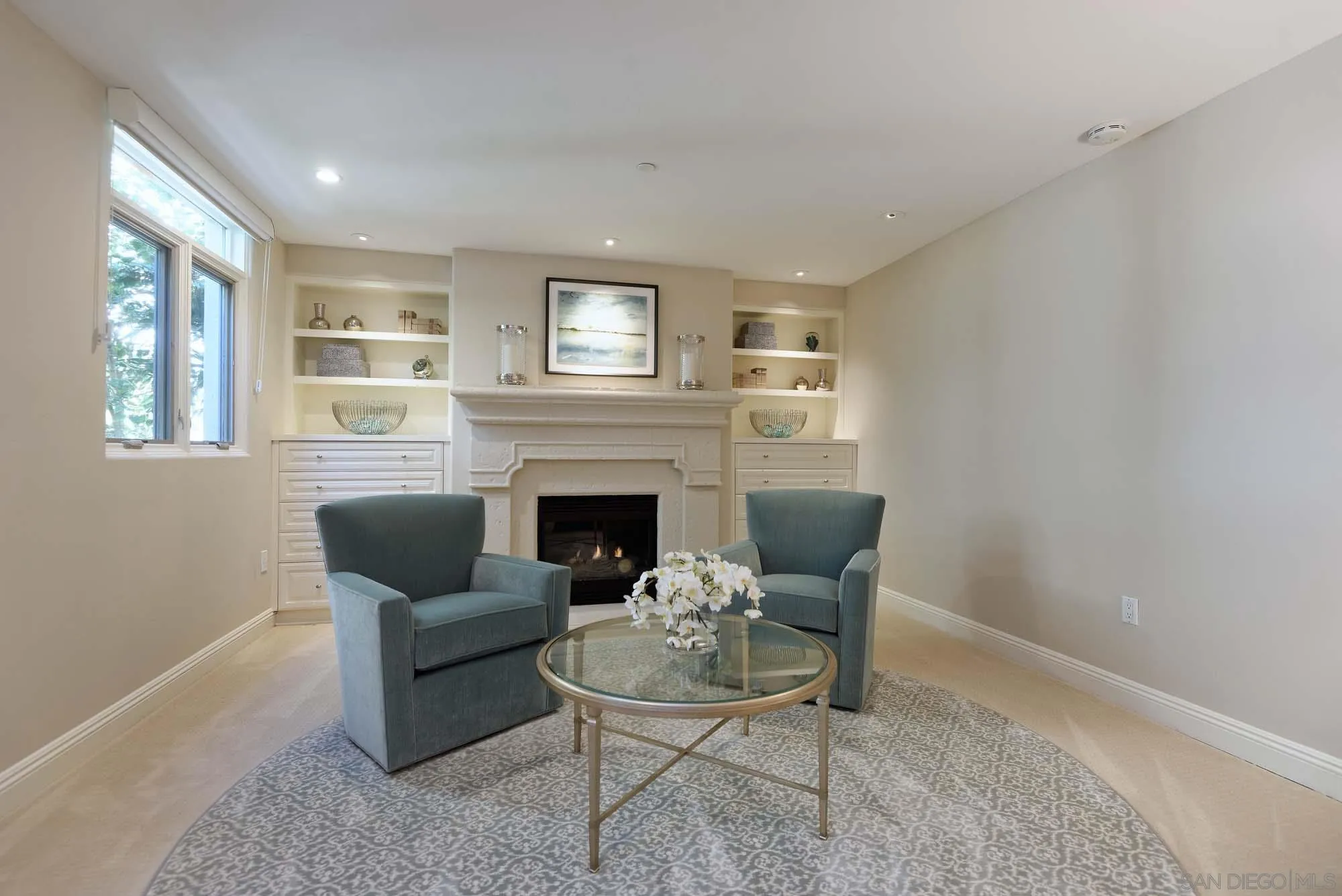 464 Prospect Street, Unit 101 La Jolla, CA 92037 - Photo 14 of 43 a living room with furniture and a fireplace