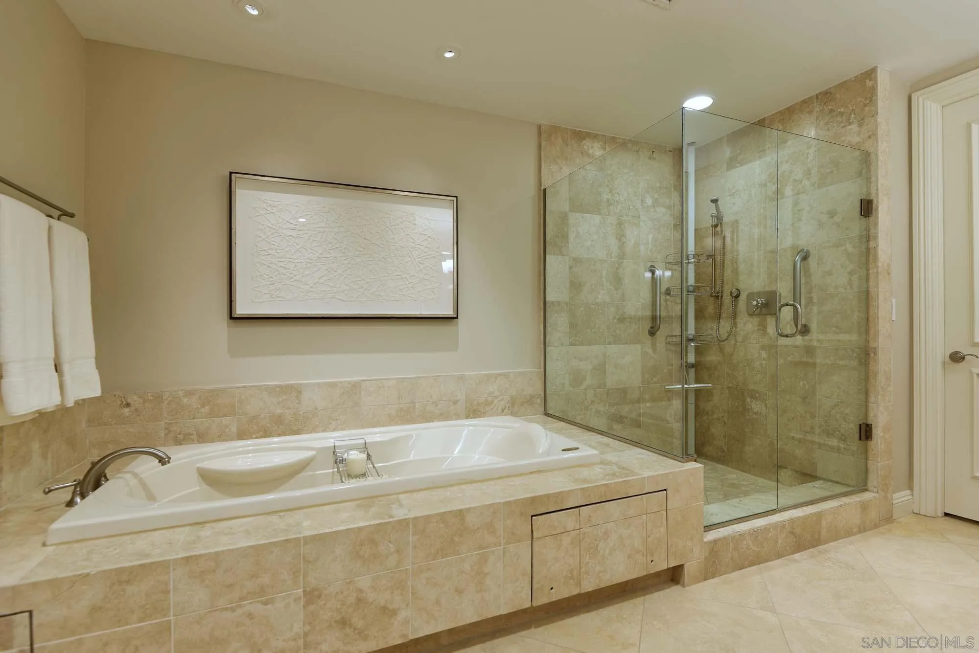 464 Prospect Street, Unit 101 La Jolla, CA 92037 - Photo 16 of 43 a bathroom with a tub a toilet and a sink
