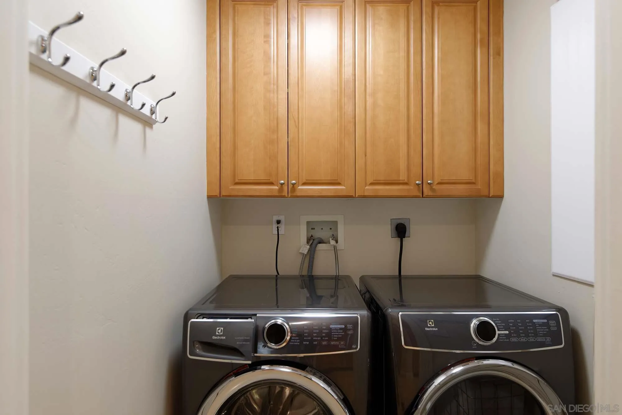 464 Prospect Street, Unit 101 La Jolla, CA 92037 - Photo 20 of 43 a view of storage and utility room with washer and dryer