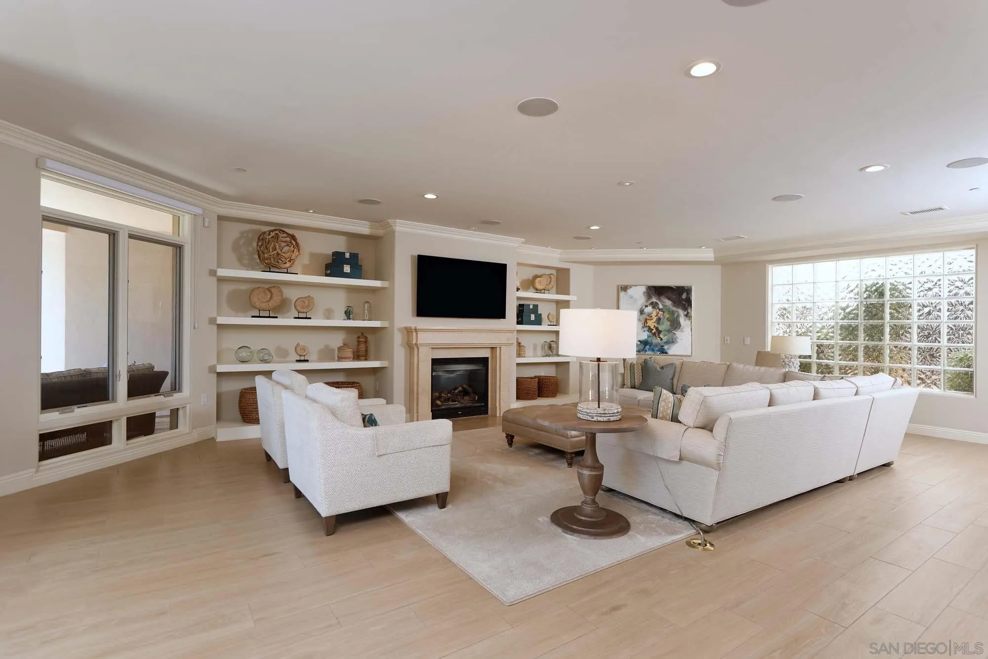 464 Prospect Street, Unit 101 La Jolla, CA 92037 - Photo 2 of 43 a living room with furniture and a flat screen tv