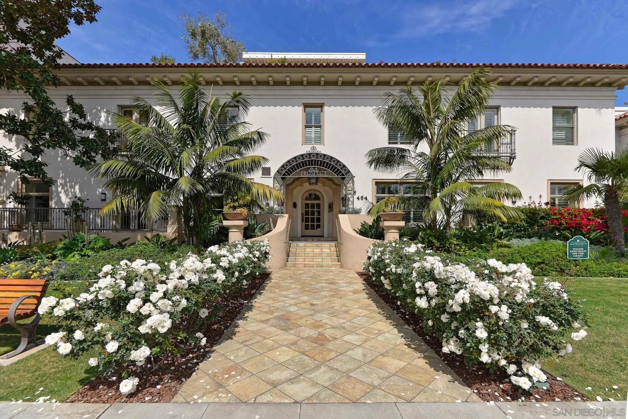 464 Prospect Street, Unit 101 La Jolla, CA 92037 - Photo 23 of 43 a front view of a house with a yard