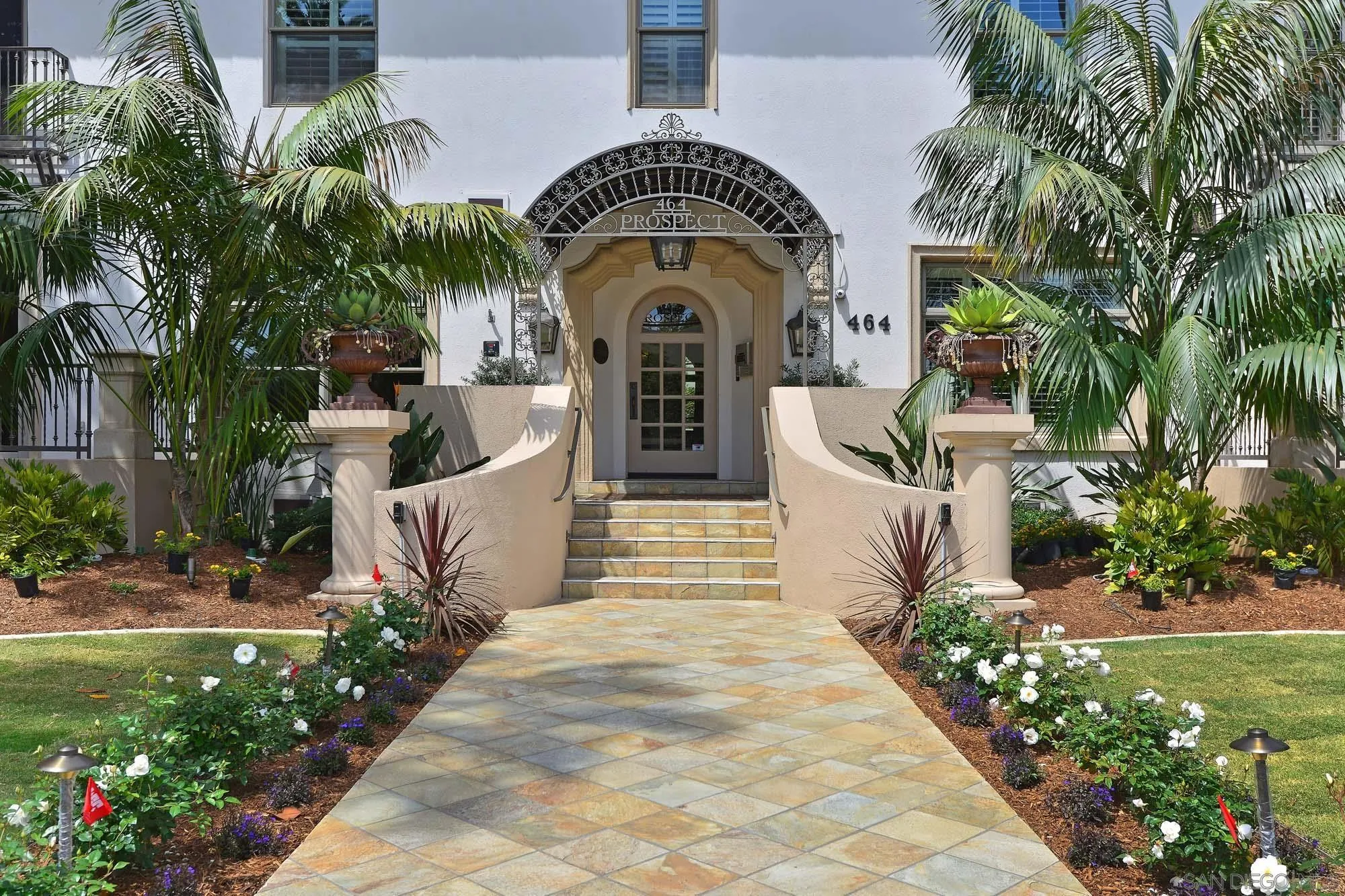 464 Prospect Street, Unit 101 La Jolla, CA 92037 - Photo 24 of 43 a view of a entrance gate of the house and trees