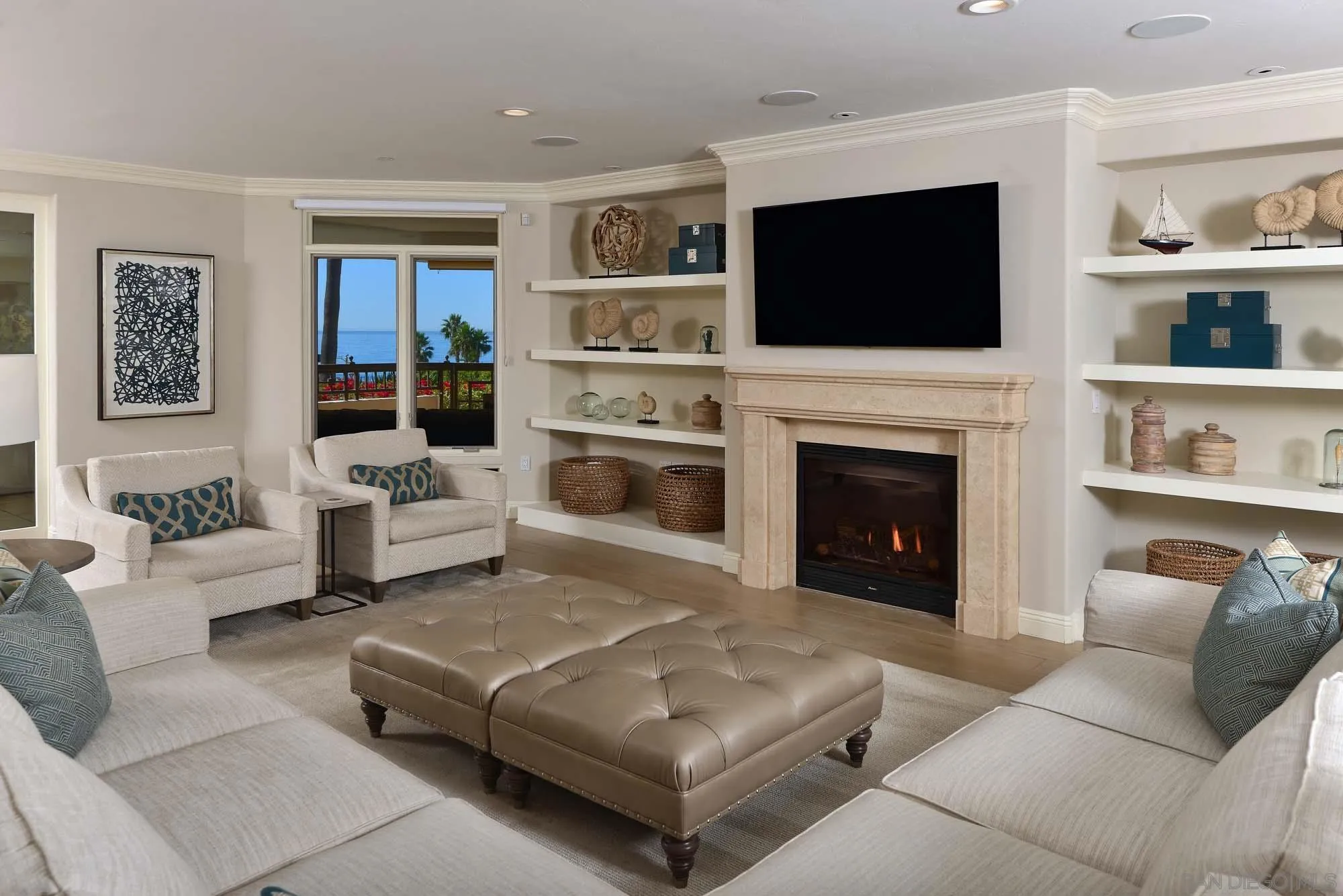 464 Prospect Street, Unit 101 La Jolla, CA 92037 - Photo 3 of 43 a living room with furniture and a fireplace