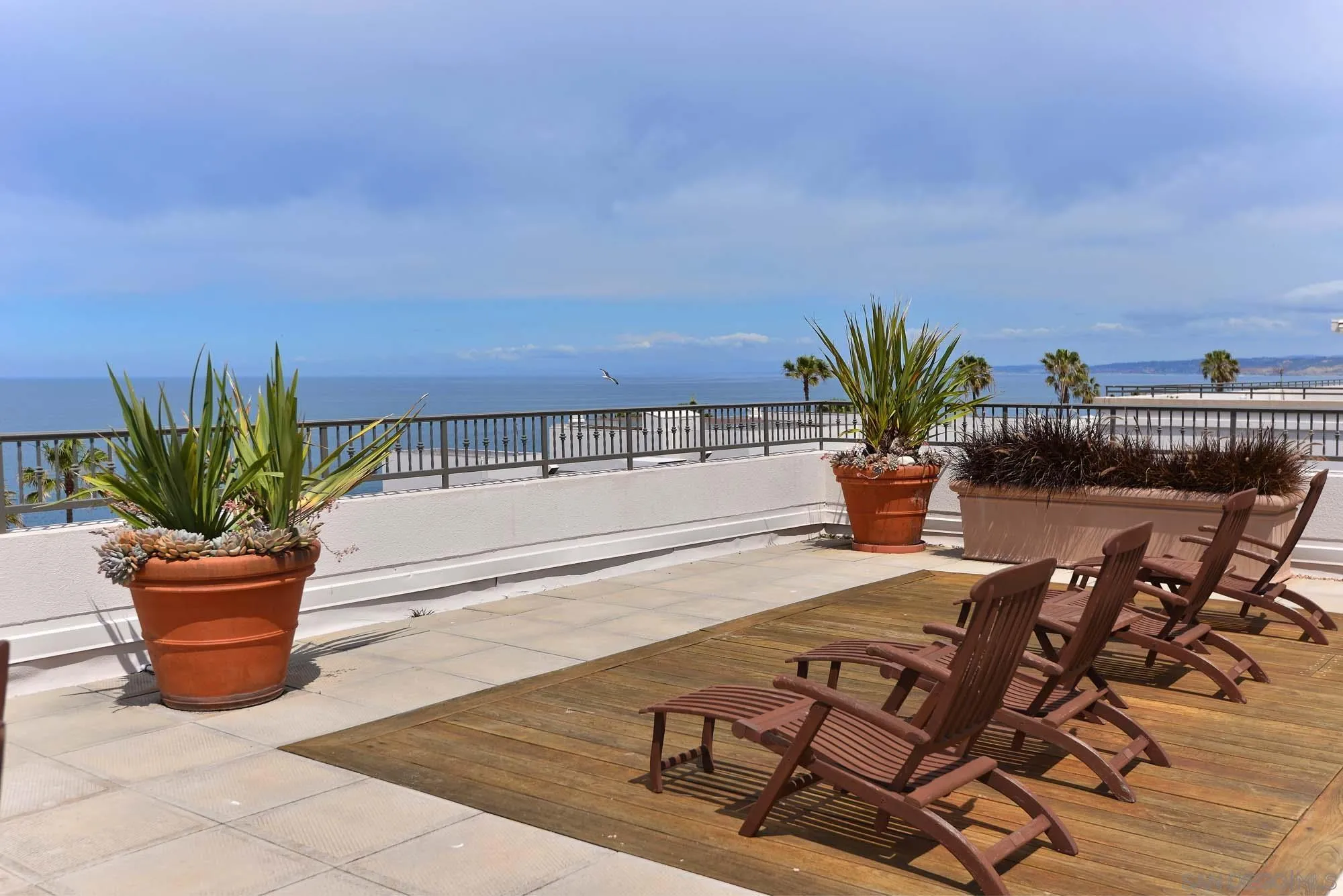 464 Prospect Street, Unit 101 La Jolla, CA 92037 - Photo 40 of 43 a view of a chairs and table on the terrace