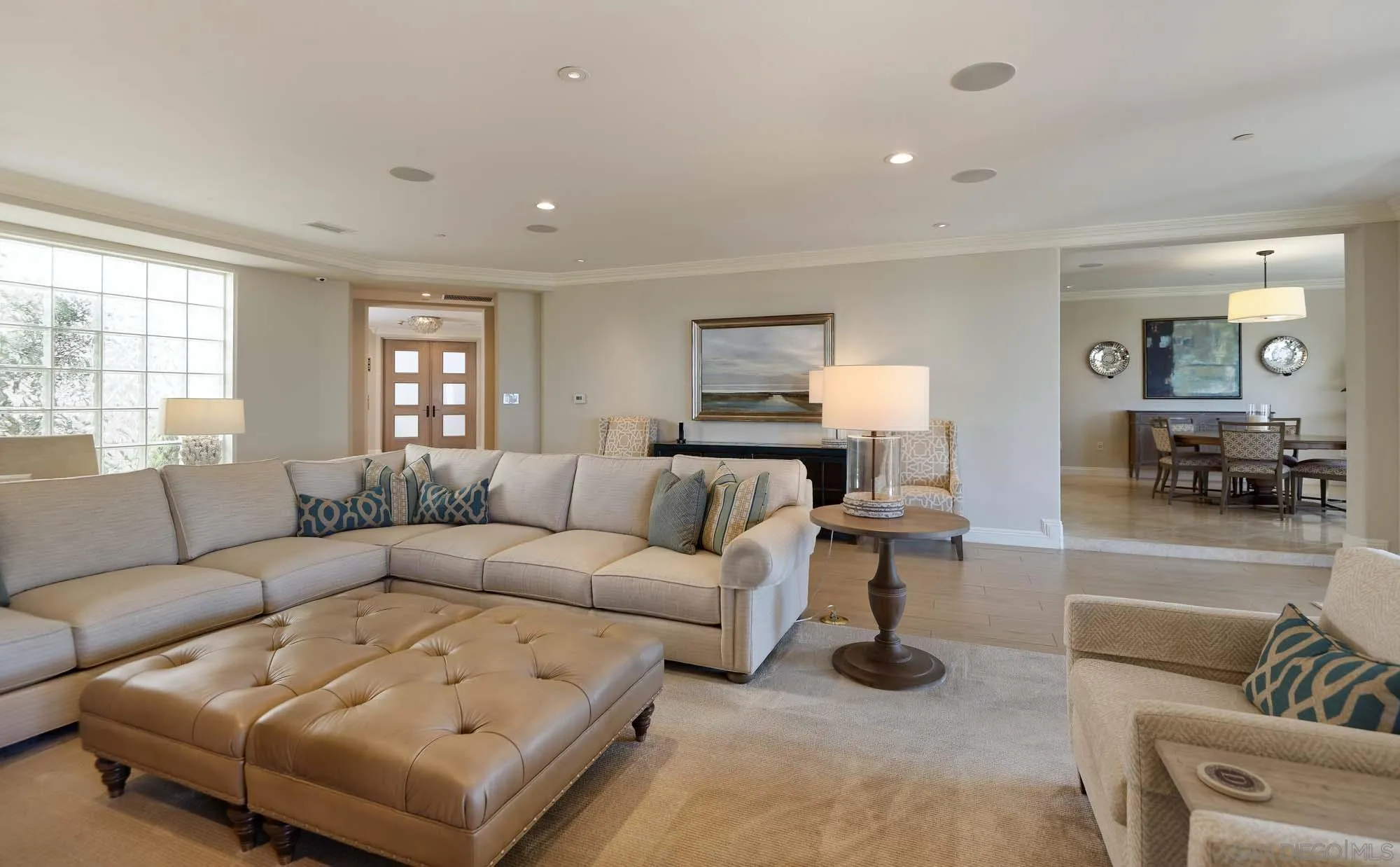 464 Prospect Street, Unit 101 La Jolla, CA 92037 - Photo 4 of 43 a living room with furniture and a large window