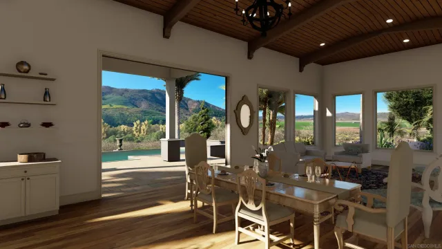 a view of a dining room with furniture wooden floor and a potted plant
